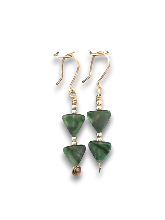 Pair of green triangle-shaped earrings with silver accents on a white background