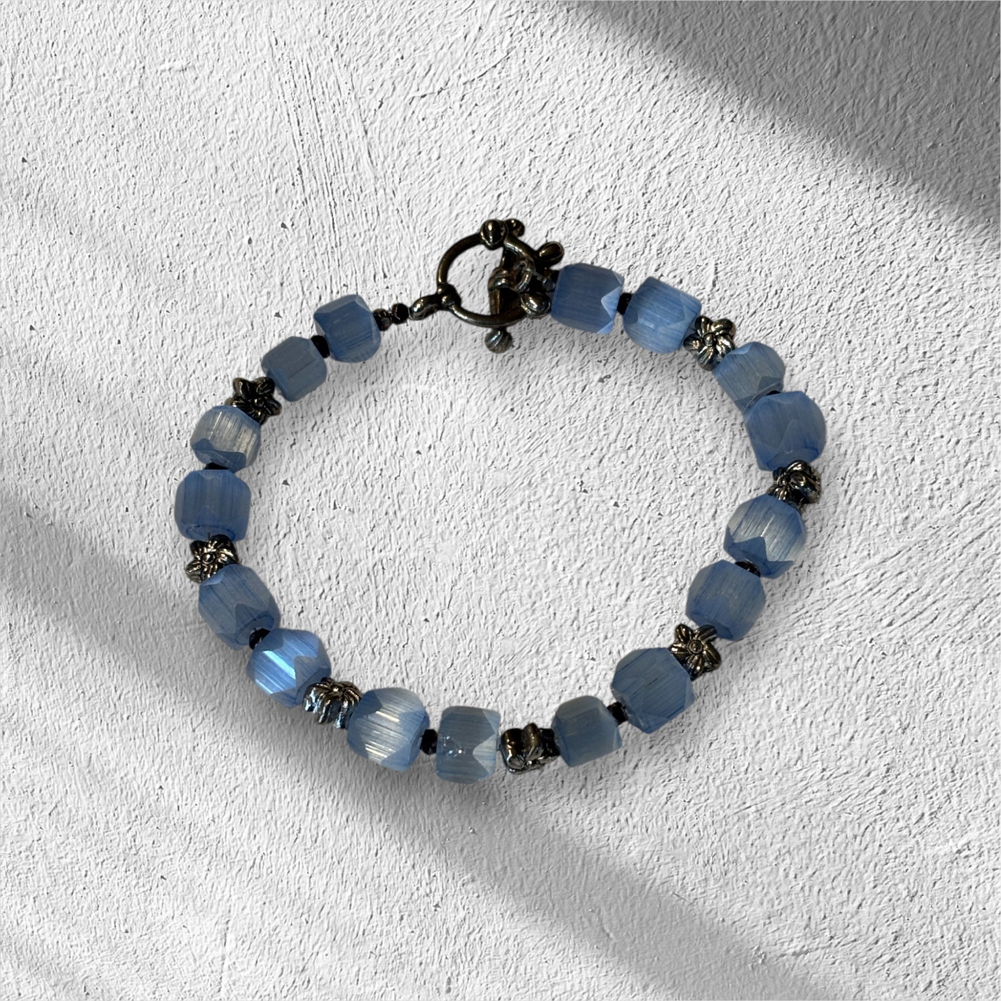 Upcycled Vintage Glass Bracelet, 7 Inch Blue Faceted Bead Bracelet with Metal Flower Spacers, Toggle Clasp