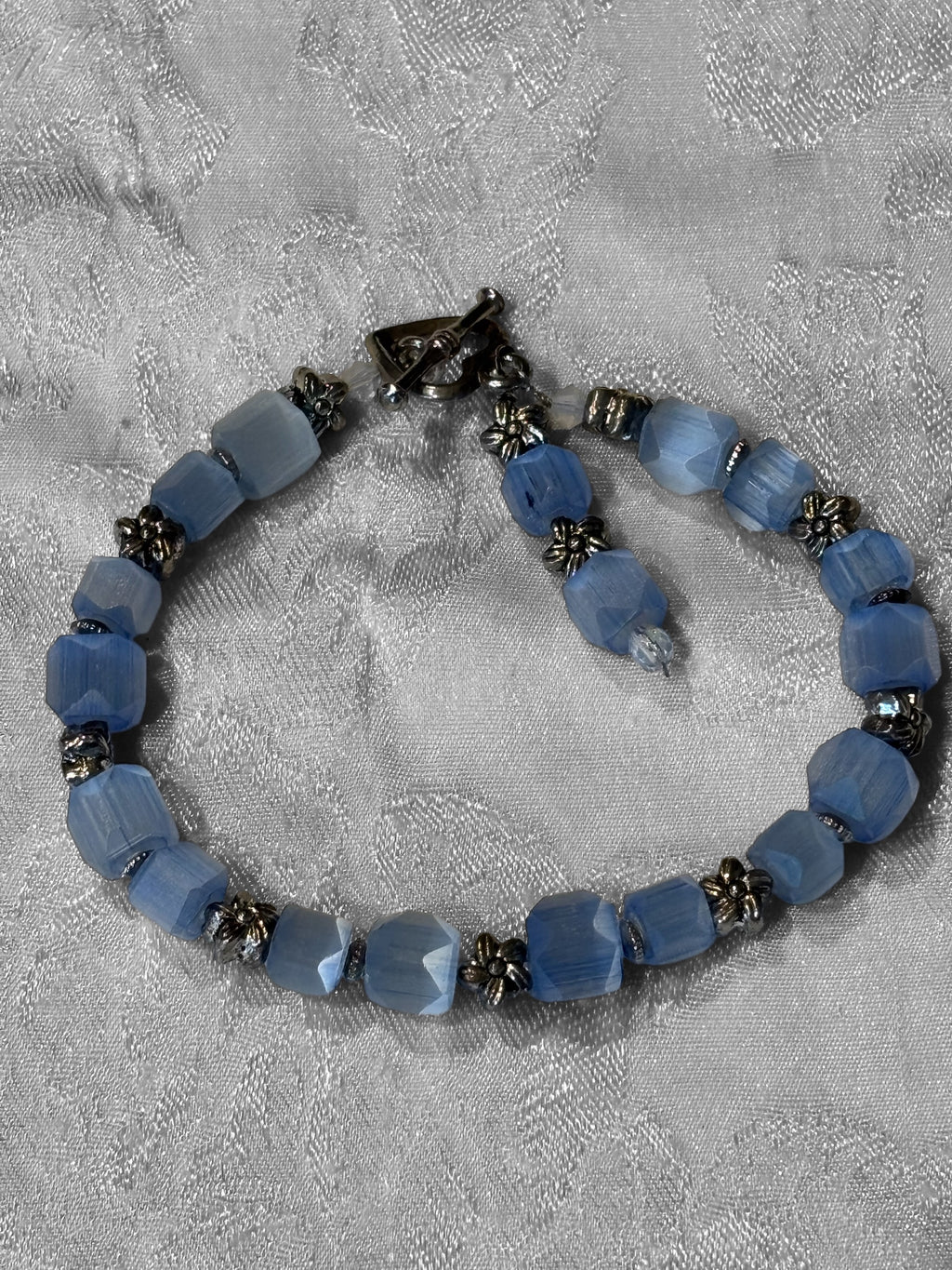 Upcycled Vintage Glass Bracelet, 7 Inch Blue Faceted Bead Bracelet with Metal Flower Spacers, Toggle Clasp