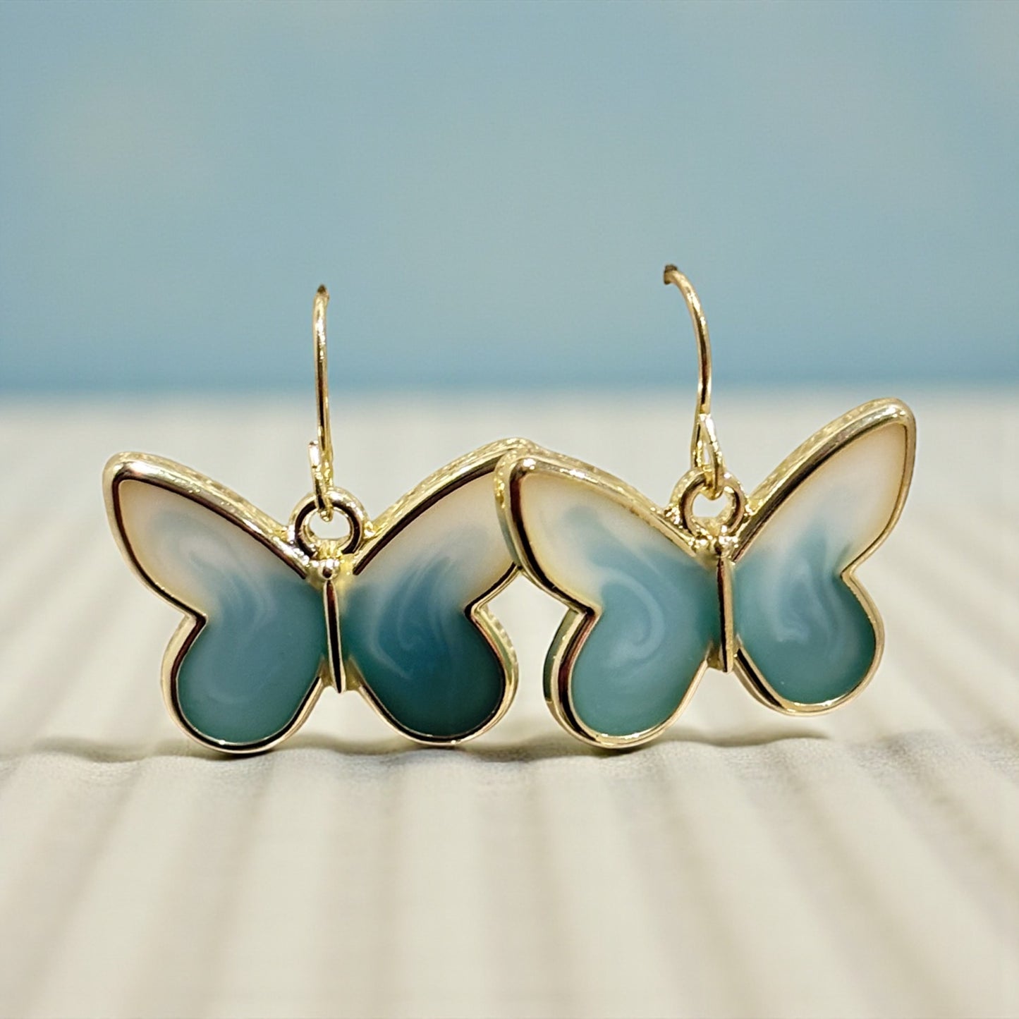 Teal & Cream Butterfly Earrings – Gold Framed Swirl Resin Dangles