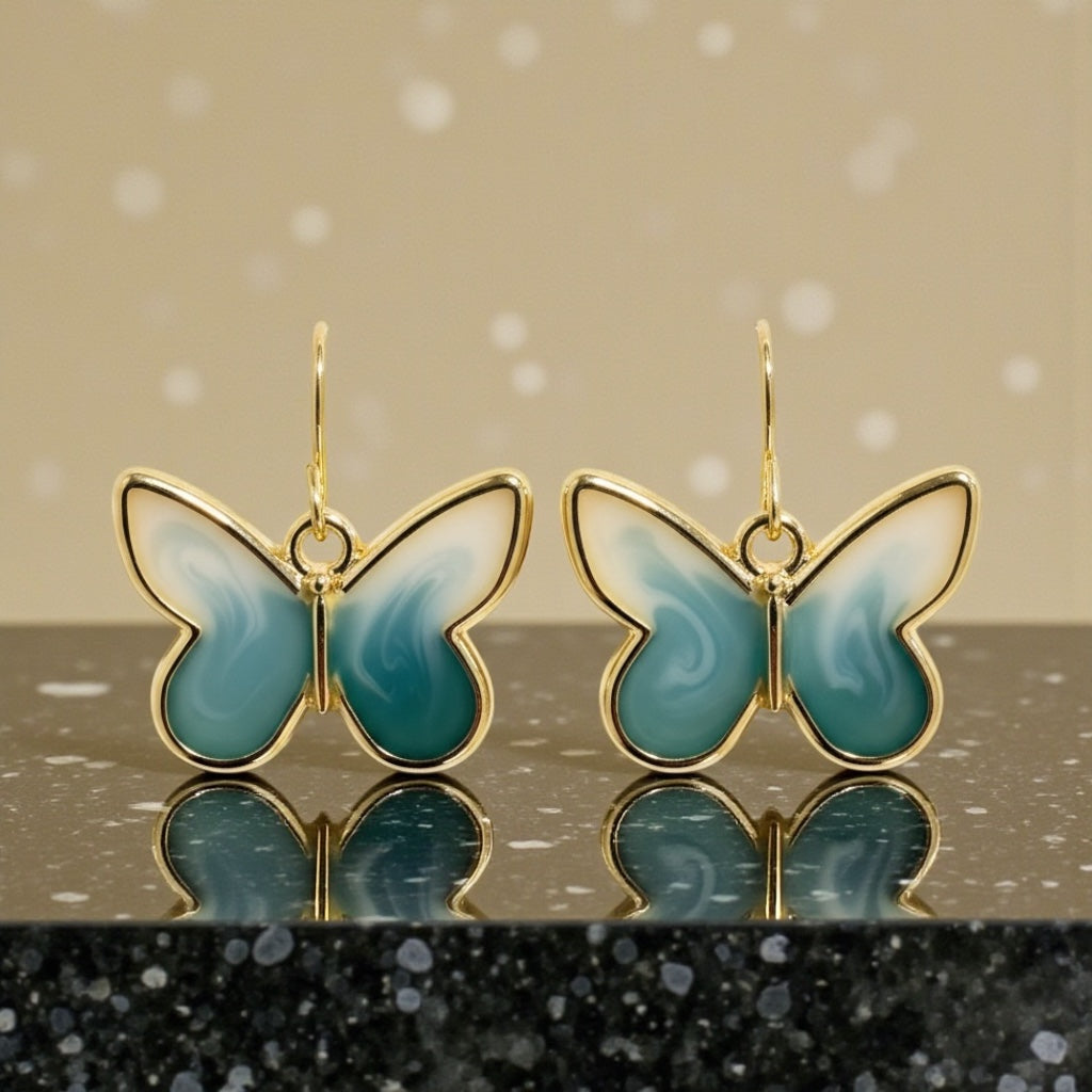 Teal & Cream Butterfly Earrings – Gold Framed Swirl Resin Dangles